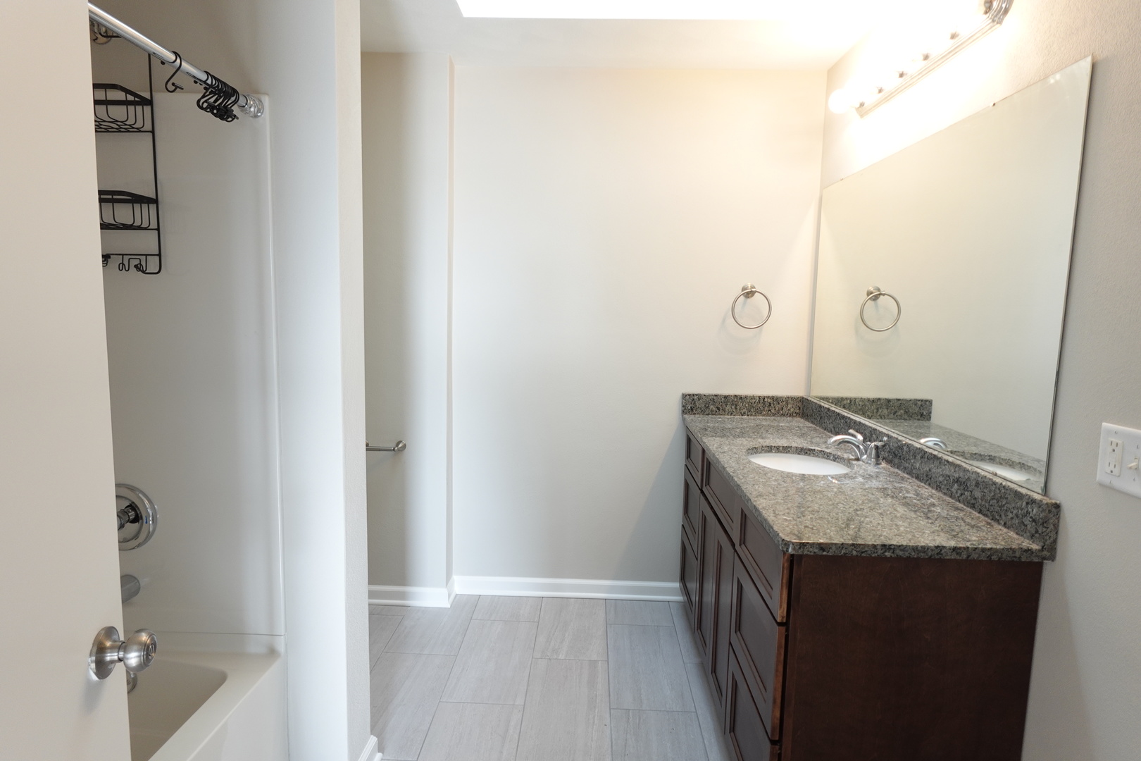 2140 Maxine Lane Rockford, IL 61102 - Photo 13 of 23 a bathroom with a granite countertop sink and a mirror