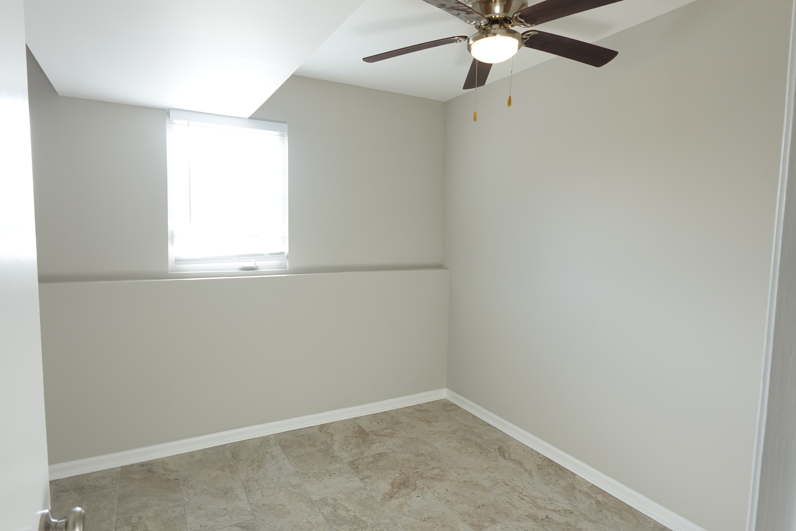 2140 Maxine Lane Rockford, IL 61102 - Photo 16 of 23 an empty room with a window and a fan