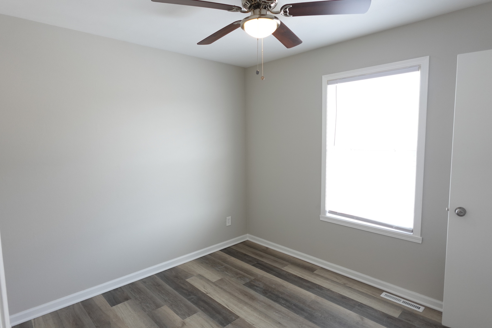 2140 Maxine Lane Rockford, IL 61102 - Photo 9 of 23 an empty room with a window and a fan