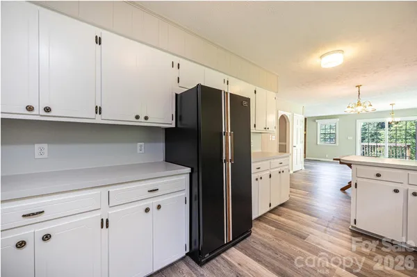 a view of a room with gym equipment and windows