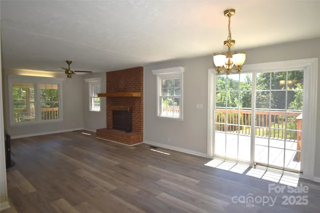 a view of a bedroom with a bed and a window