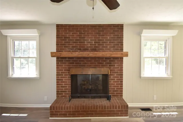 a bathroom with a sink a toilet and a shower curtain