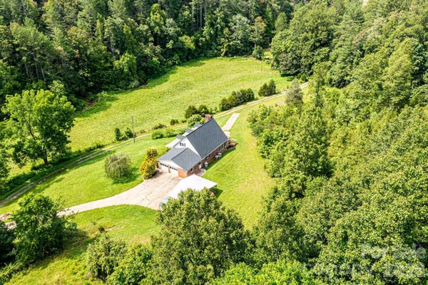 a view of a yard with swimming pool