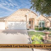 a view of a house with backyard