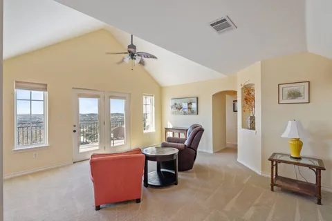 a living room with furniture and a window