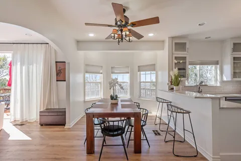 a dining room with furniture and window