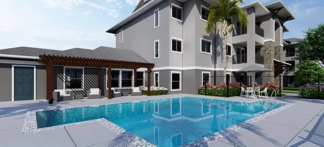 a front view of a house with porch and sitting area