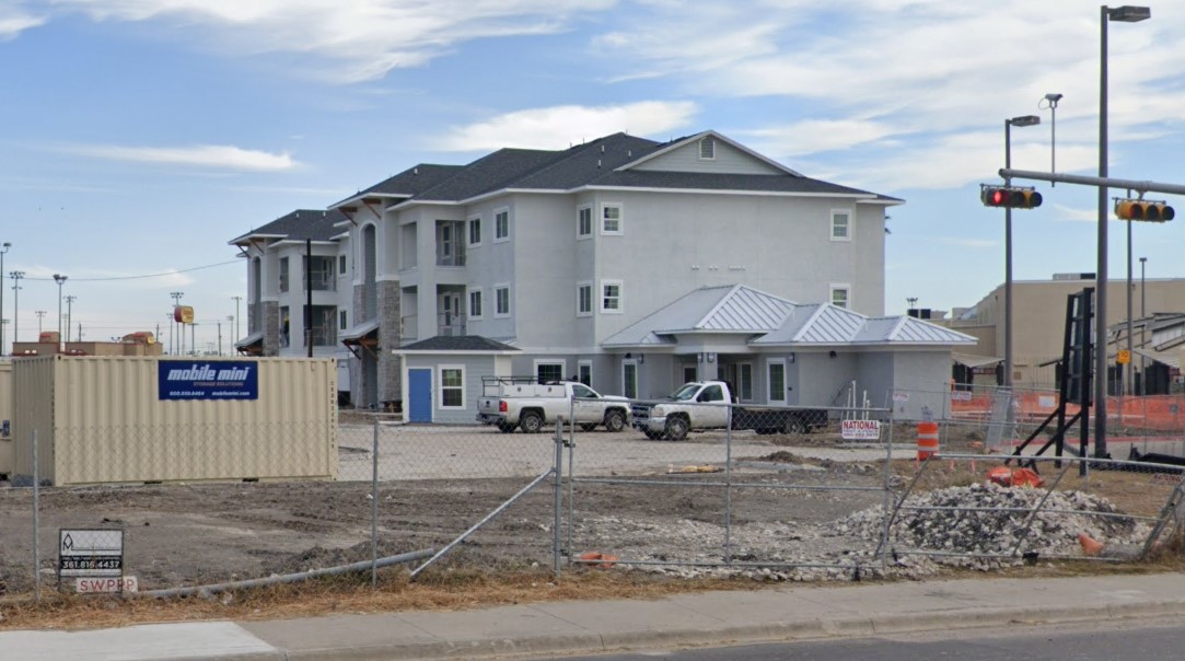 5302 McArdle Road Corpus Christi, TX 78411 - Photo 7 of 7 a front view of a building with many windows