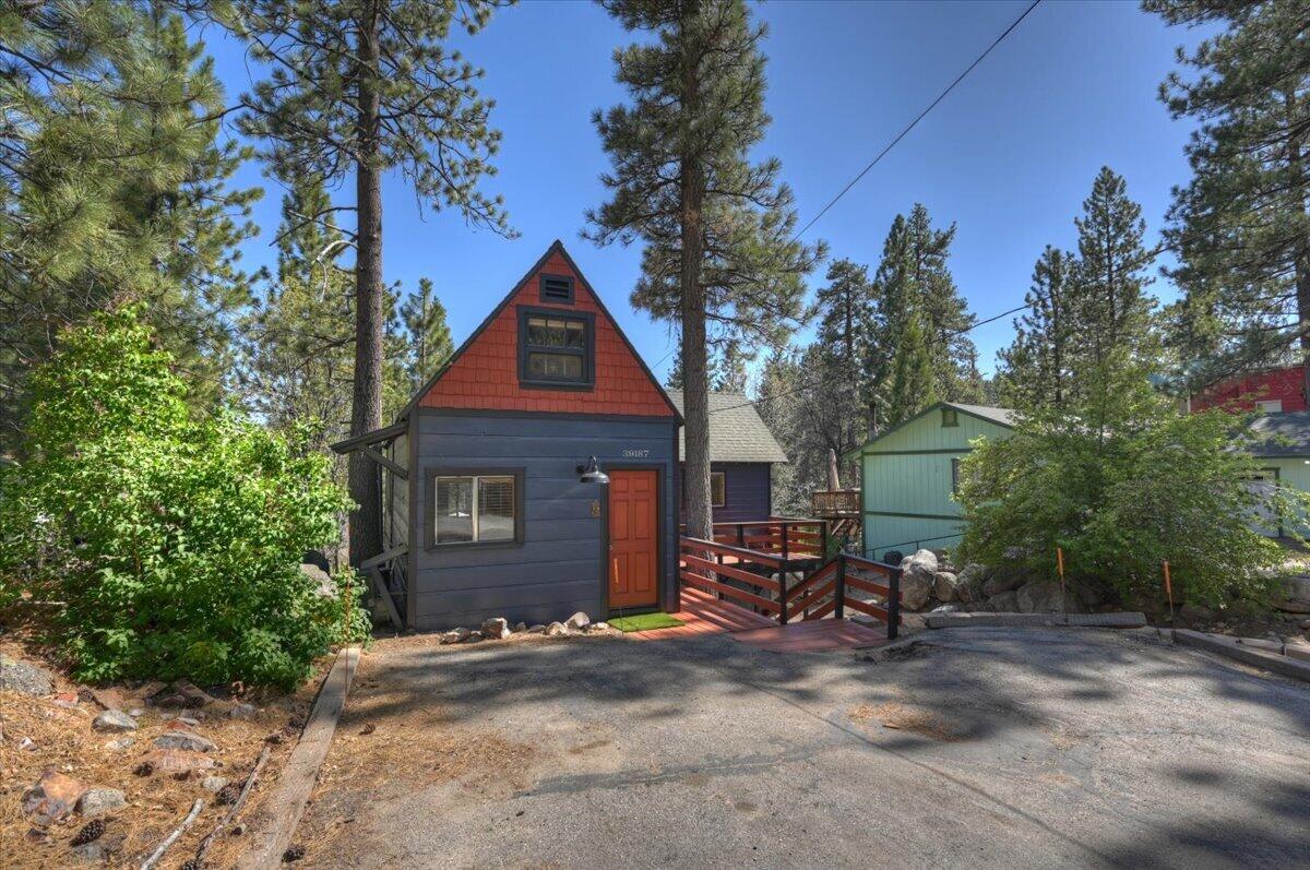 39187 Arapahoe Road Fawnskin, CA 92333 - Photo 29 of 33 a view of house with outdoor space and trees