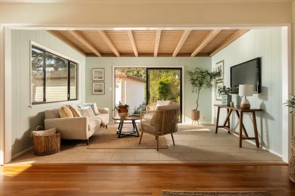 a living room with furniture and a flat screen tv