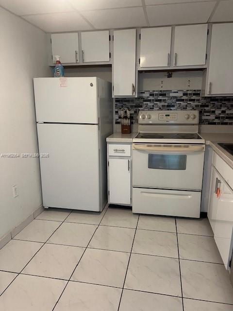 2055 Southwest 122nd Avenue, Unit 519 Miami, FL 33175 - Photo 2 of 13 a kitchen with cabinets and white appliances