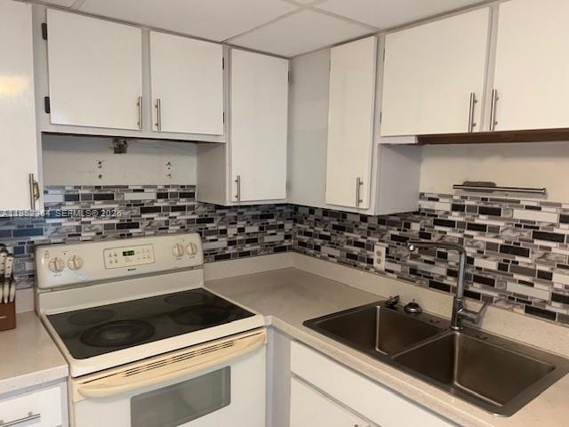 2055 Southwest 122nd Avenue, Unit 519 Miami, FL 33175 - Photo 3 of 13 a kitchen with granite countertop white cabinets and sink
