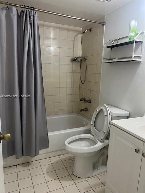 2055 Southwest 122nd Avenue, Unit 519 Miami, FL 33175 - Photo 4 of 13 a white toilet sitting next to a bath tub and a shower