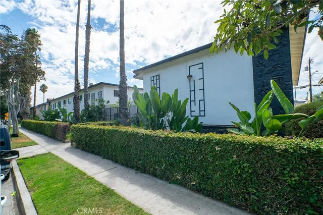 a view of a house with a yard and plants