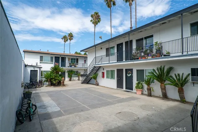 a view of a building with potted plants