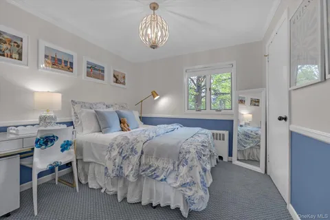 a bedroom with bed and window