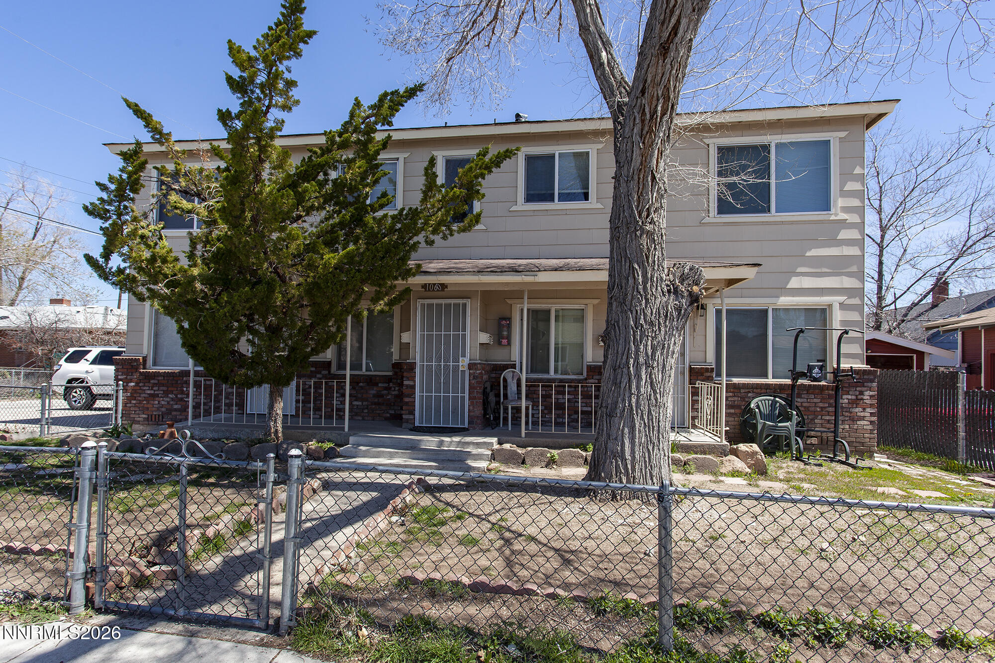 1060 Wilson Avenue Reno, NV 89502 - Photo 1 of 17 front view of a house with a tree