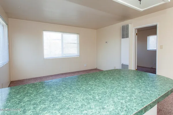 a view of an empty room and window
