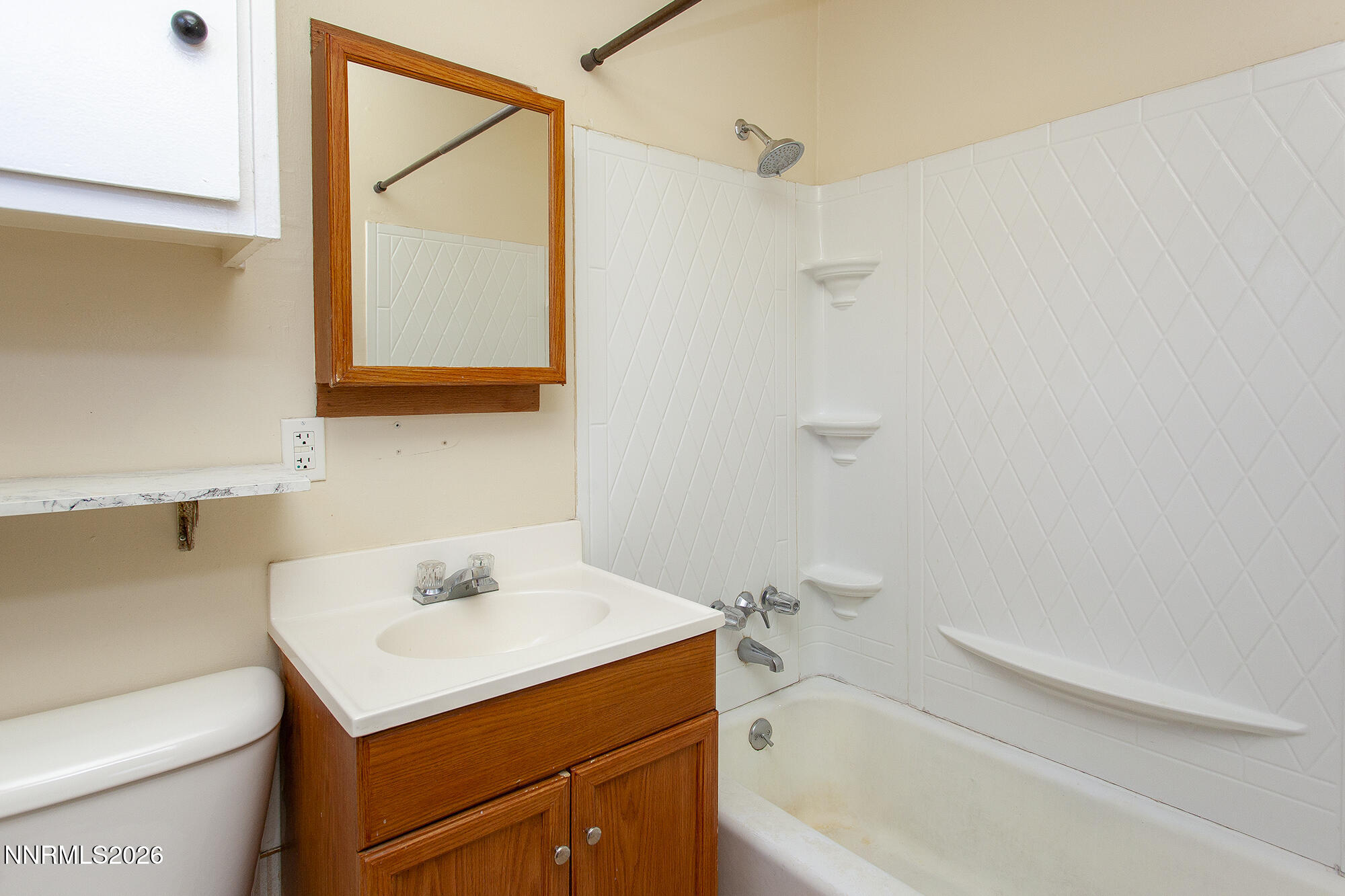 1060 Wilson Avenue Reno, NV 89502 - Photo 13 of 17 a bathroom with a sink a toilet and shower