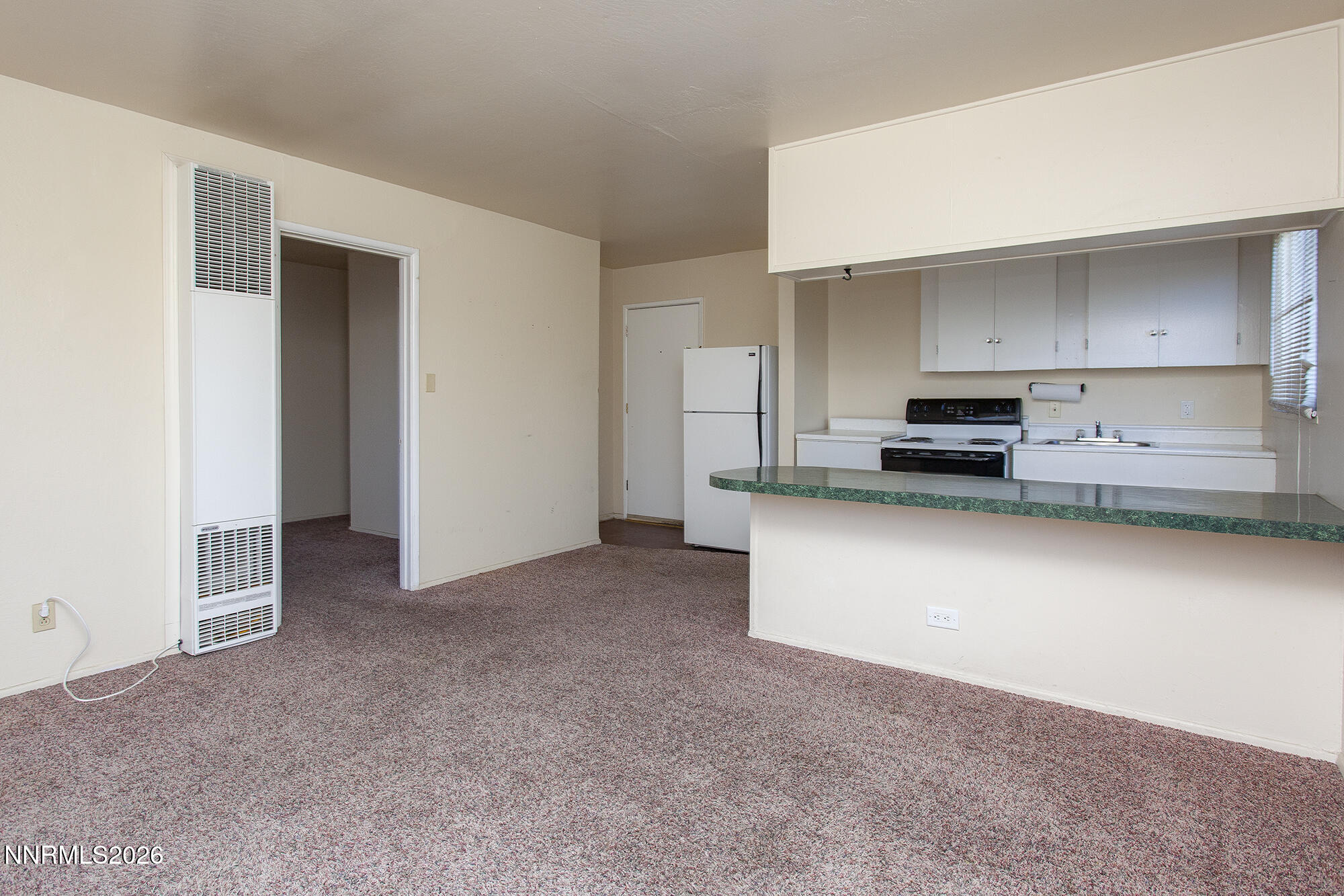 1060 Wilson Avenue Reno, NV 89502 - Photo 8 of 17 a kitchen with cabinets and a stove top oven