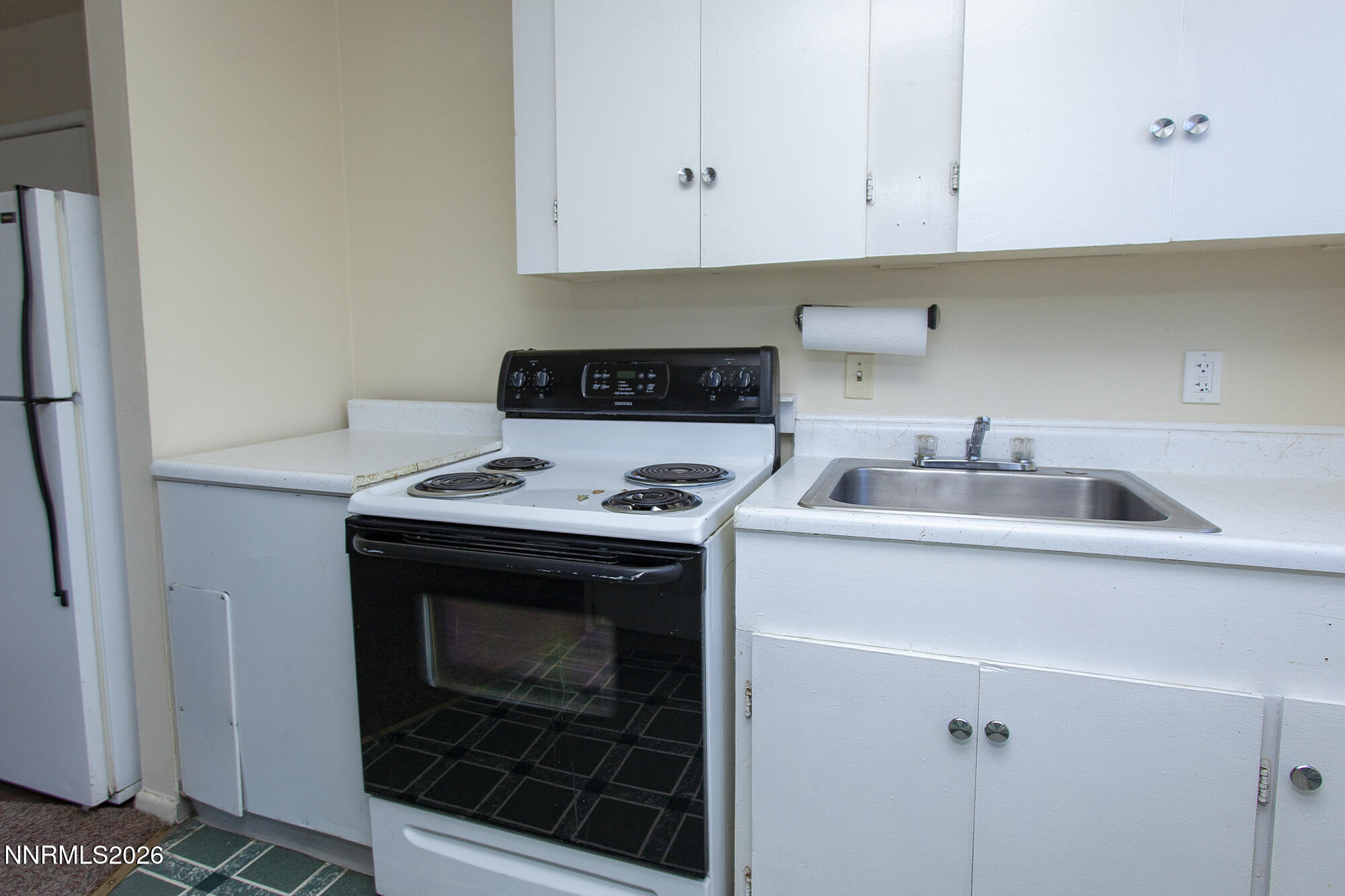 1060 Wilson Avenue Reno, NV 89502 - Photo 9 of 17 a kitchen with a sink stove and cabinets