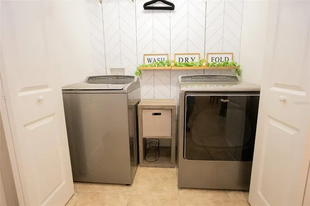 a living room with lots of gym equipment