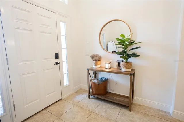a living room with a sink and a mirror