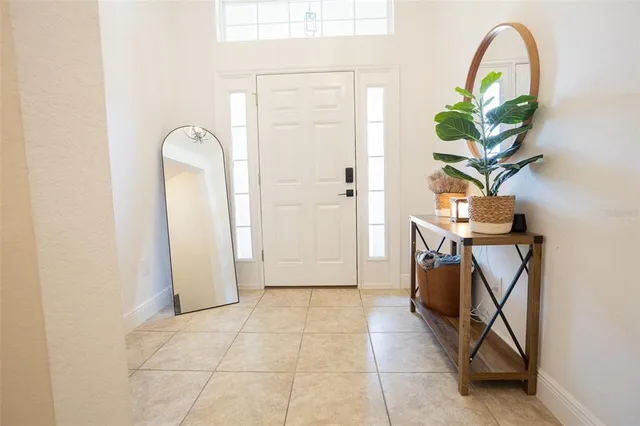 a kitchen with stainless steel appliances granite countertop a stove top oven a sink dishwasher and a refrigerator