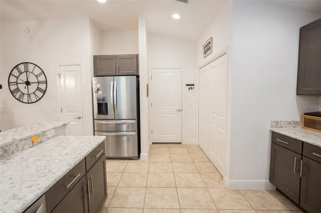 a living room with furniture a rug and a large window