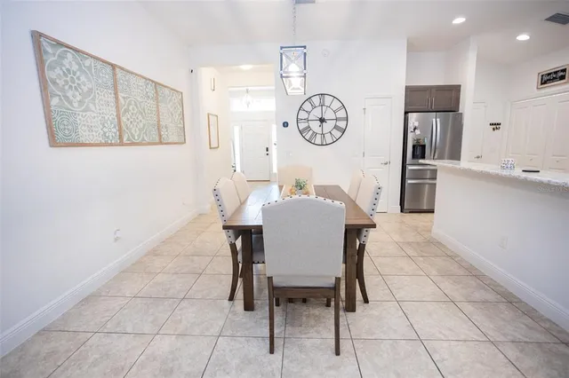 a bedroom with a bed a table and chair