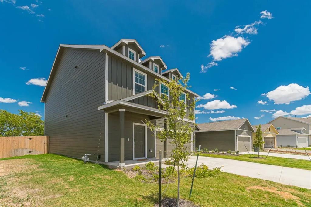 441 Gabbro Gardens Maxwell, TX 78656 - Photo 15 of 22 a front view of a house with a yard