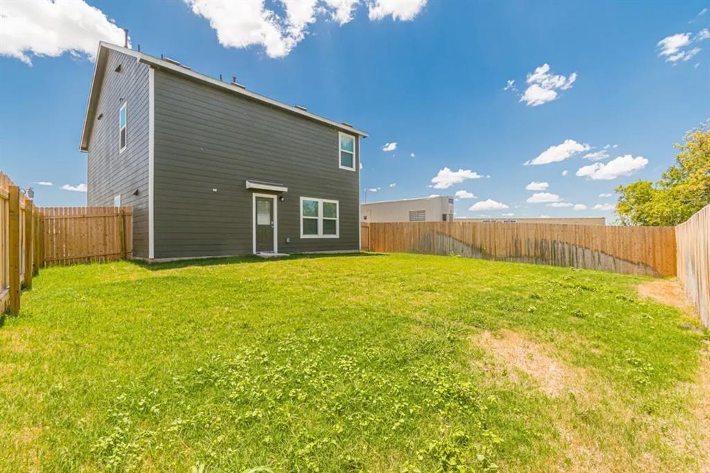 441 Gabbro Gardens Maxwell, TX 78656 - Photo 16 of 22 a view of a house with a yard