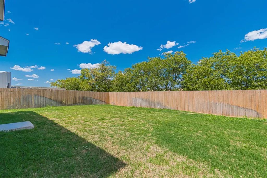 441 Gabbro Gardens Maxwell, TX 78656 - Photo 17 of 22 a view of a backyard with a fence