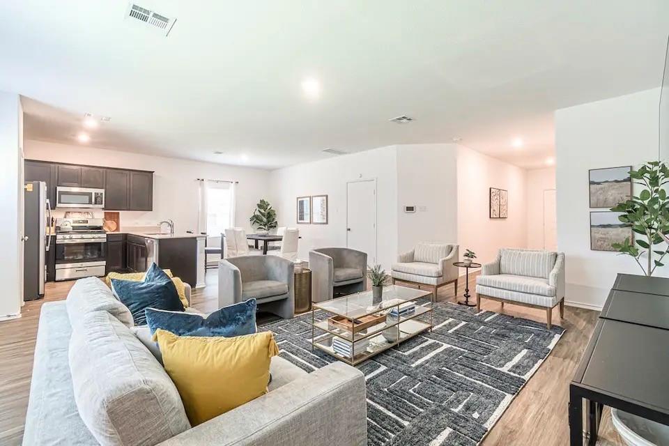 441 Gabbro Gardens Maxwell, TX 78656 - Photo 2 of 22 a living room with furniture kitchen view and a table