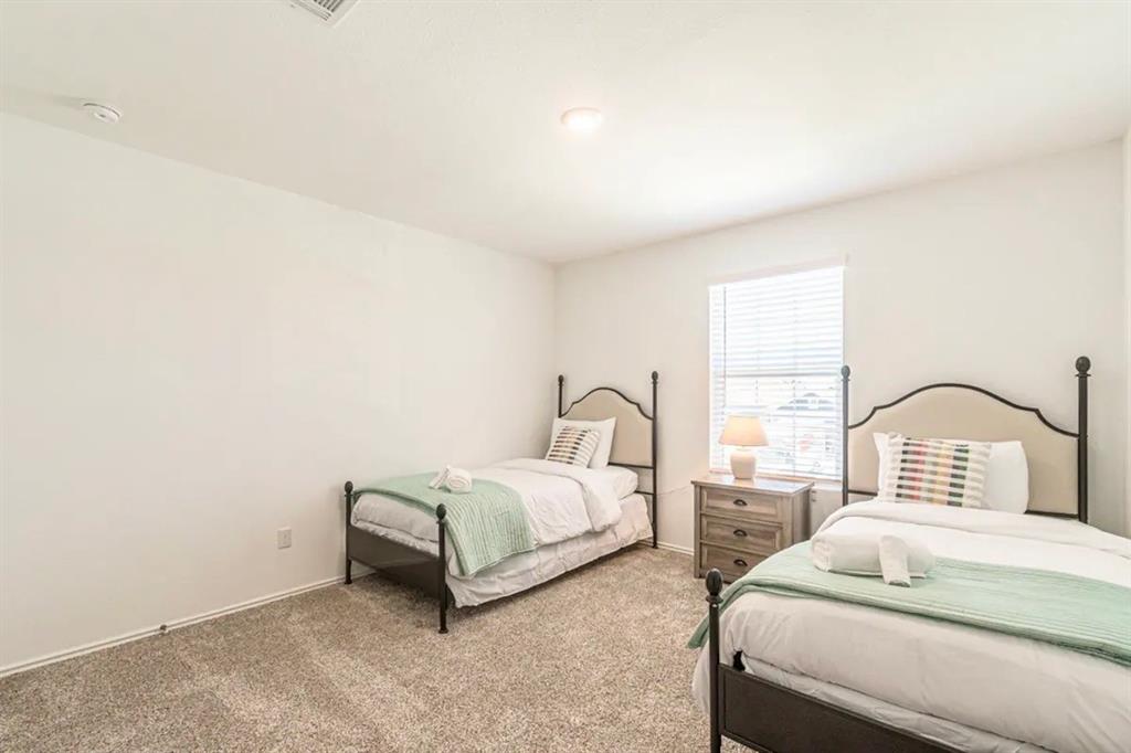 441 Gabbro Gardens Maxwell, TX 78656 - Photo 21 of 22 a bedroom with bed and a window