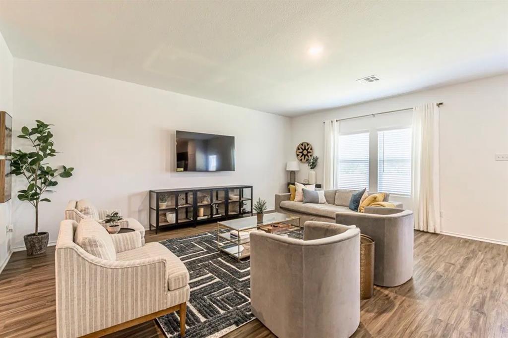 441 Gabbro Gardens Maxwell, TX 78656 - Photo 5 of 22 a living room with furniture and a potted plant