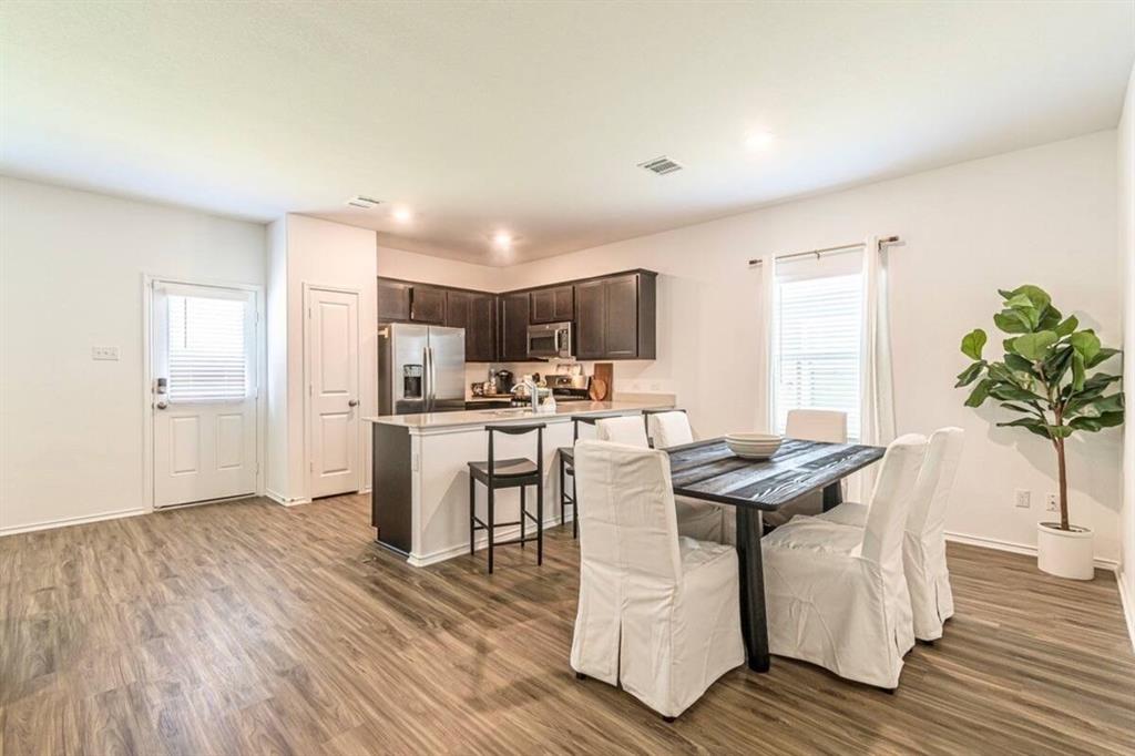 441 Gabbro Gardens Maxwell, TX 78656 - Photo 6 of 22 a living room with furniture and a wooden floor