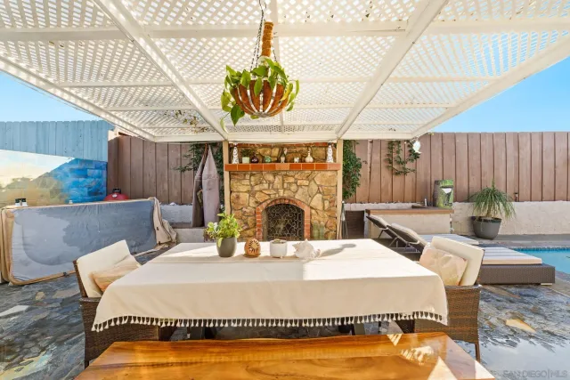 a bed sitting in a bedroom next to a larger window