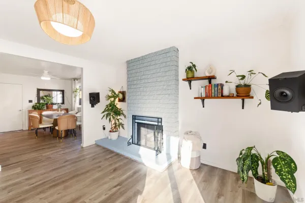a living room with furniture and wooden floor