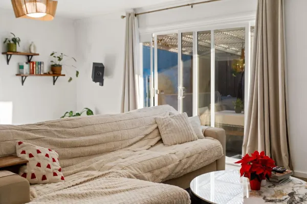 a living room with furniture and a large window