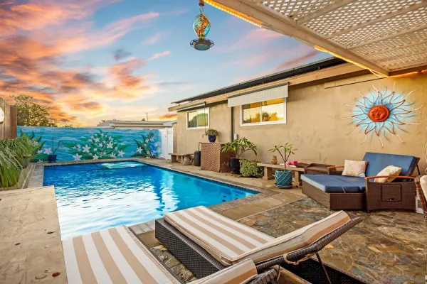 a view of a swimming pool with seating area