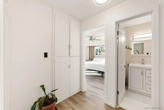 a en suite bathroom with a shower a sink and a mirror