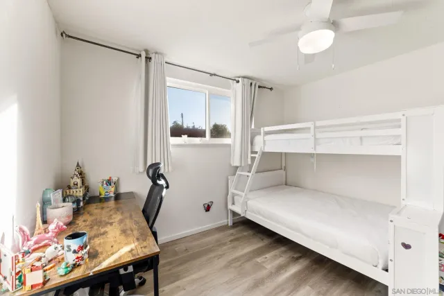 a room with a bed and furniture