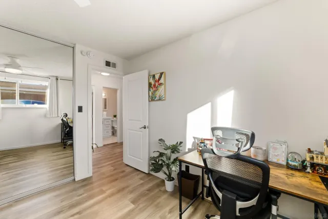 a workspace with furniture and wooden floor