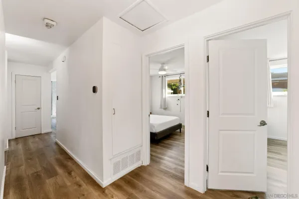 a view of a bathroom from a hallway