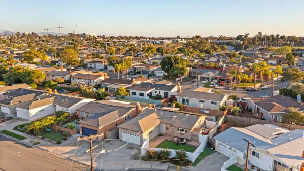 an aerial view of a city with lots of residential buildings
