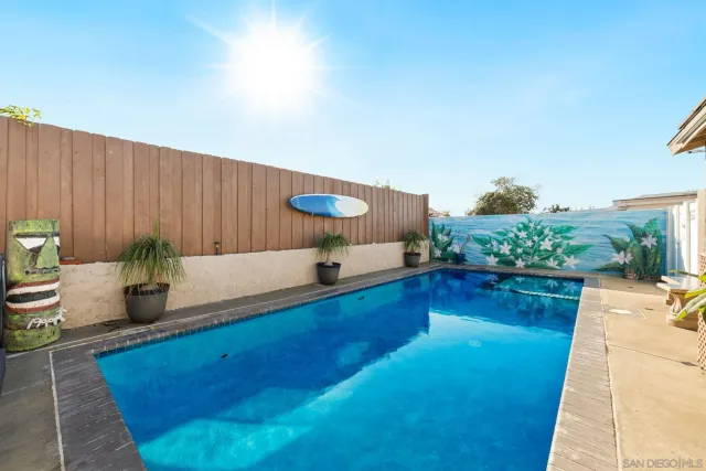 a view of a swimming pool and lounge chair