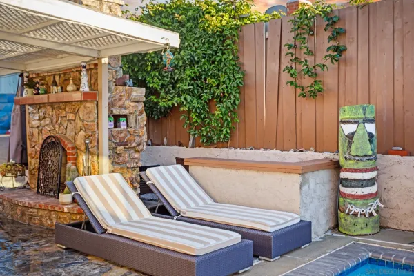 a balcony with furniture and a potted plant