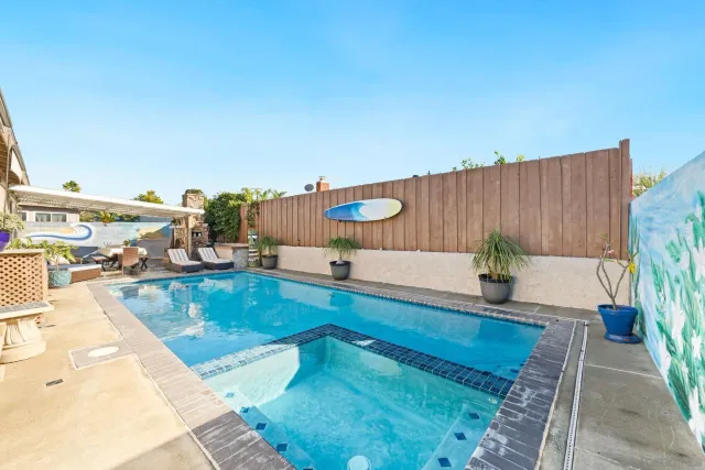 a view of a swimming pool and a patio