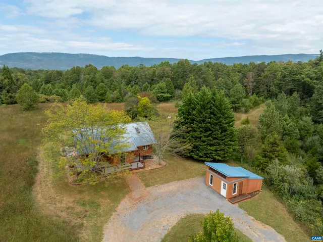 a view of a lake with a yard